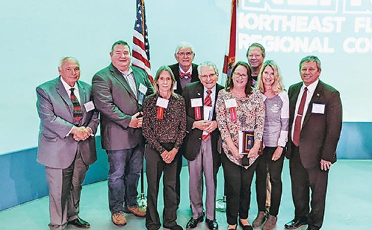 Putnam County officials hold the awards the county received Thursday during the Northeast Florida Regional Council’s annual recognition event in Jacksonville.