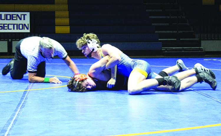 ’s Brandon Lewis has Tocoi Creek’s Lucas Harraway in an armlock during the second period of their 138-pound match Thursday. Lewis would pin Harraway to secure the Panthers’ 38-30 victory. (MARK BLUMENTHAL / Palatka Daily News)