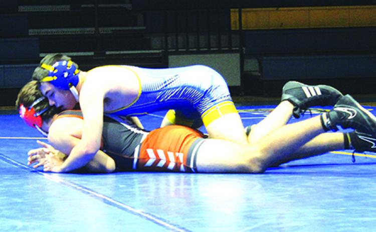 Hayden Edwards has the upper hand in his match early at home against Tocoi Creek’s Josh Gambil on Jan. 20. (MARK BLUMENTHAL / Palatka Daily News)