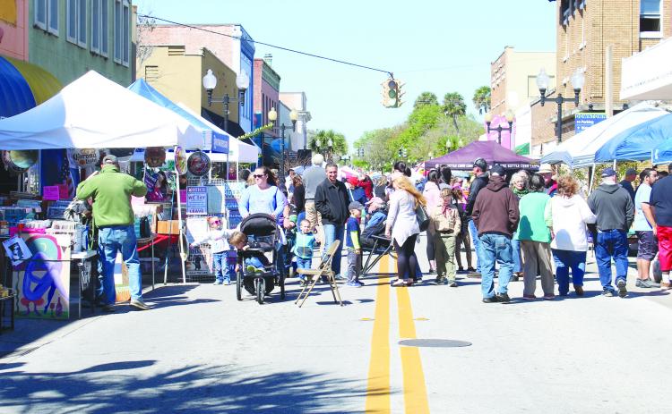 File photo. Crowds gather on St. Johns Avenue in March 2020 as they visit vendors during the 74th Azalea Festival. 