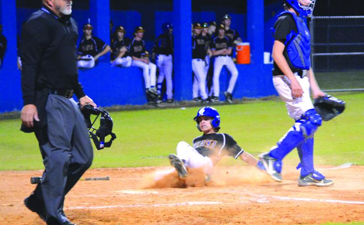 Palatka’s Tanner Ortiz scores a third-inning run against Interlachen as catcher Miles Hoffman gets out of the way in Tuesday’s county tournament semifinal. (CASMIRA HARRISON / Palatka Daily News)