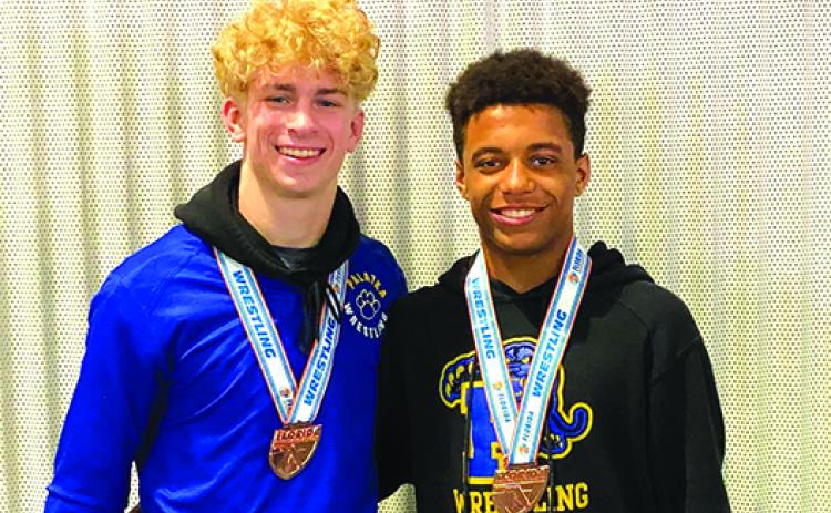 Palatka’s Brandon Lewis (left) and Mikade Harvey are smiles Saturday after each finished third place individually at the FHSAA 1A wrestling championship at Silver Spurs Arena. (Submitted / Josh White)