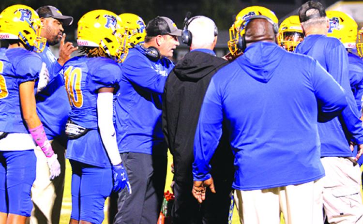 Palatka High School football coach Patrick Turner talks to his team during a timeout on Oct. 29 against Menendez. (MARK BLUMENTHAL / Palatka Daily News)