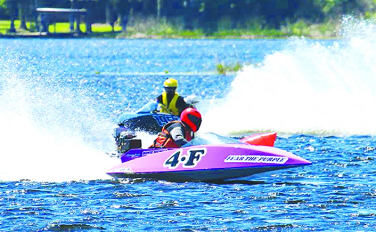 Howie Nichols of Cocoa rides the waters of Lake Stella in his Fear The Purple 4-F boat during Sunday’s Romp In The Swamp competition. (Contributed / JESSE LYONS)