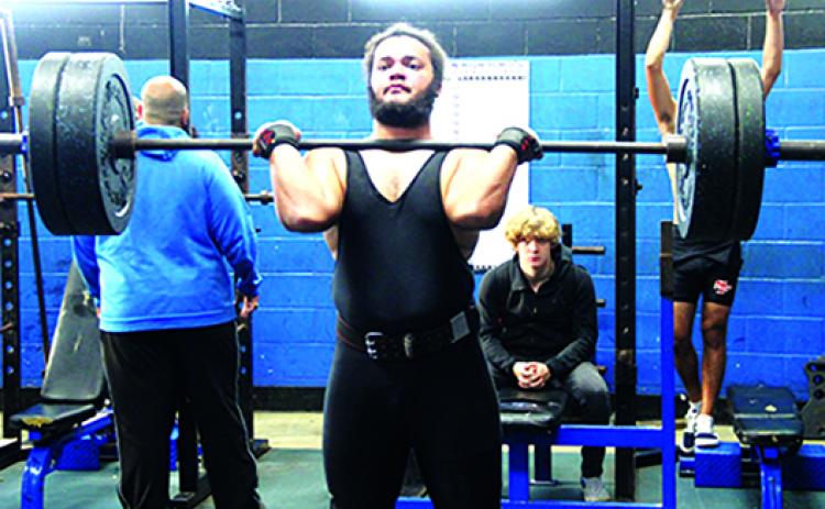  Interlachen’s Nate Jenkins gets set to finish his clean-and-jerk attempt in winning the District 8-1A championship at 238 pounds. (COREY DAVIS / Palatka Daily News)
