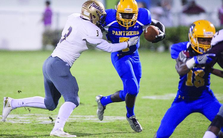 Palatka's Markell Rasher tries to break a St. Augustine tackle during the 2016 matchup at Bennett Cooper Field at Veterans Memorial Stadium (Daily News file photo)