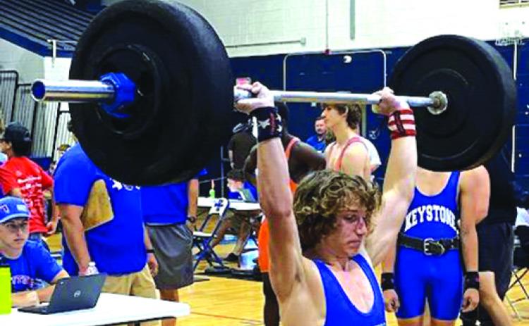 Palatka’s Kyler Smith, who took third at the 139-pound weight class, lifts in the clean-and-jerk competition on Friday at Keystone Heights High School. (COREY DAVIS / Palatka Daily News)