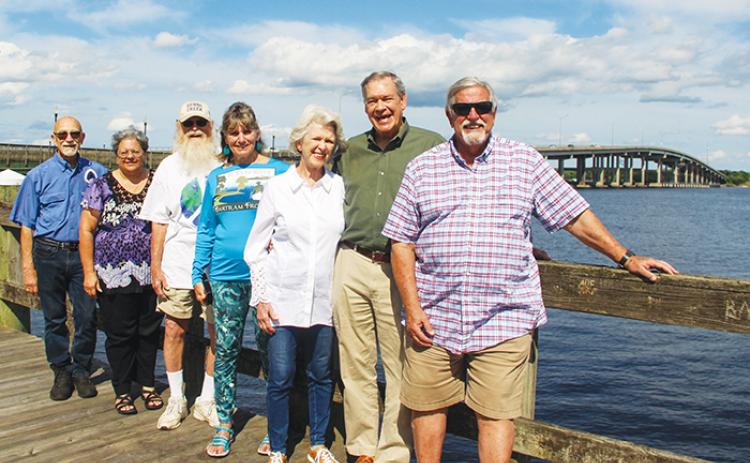 Bartram Trail Society of Florida members stand against a backdrop of the St. Johns River and Memorial Bridge on Monday, just four days ahead of the Bartram Frolic.