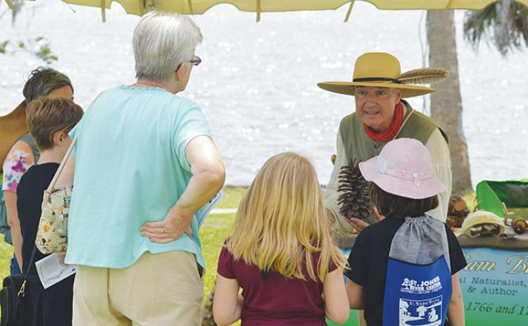 A William Bartram re-enactor informs local children about the plant life the real Bartram encountered during his travels throughout the area in the 18th century.