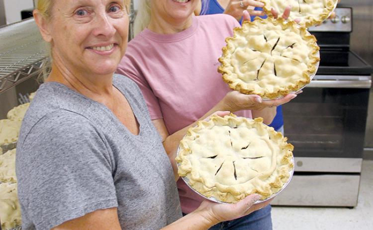 Volunteer kitchen crew members have been making blueberry pies and muffins for the past three days in preparation for Saturday’s Bostwick Blueberry Festival. From front to back are Heidi Hockenberry, Angela DeLettre and Dawn Rawls.