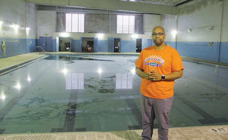 The Rev. Herbert Johnson stands in front of the Family Life Center’s pool earlier this month.