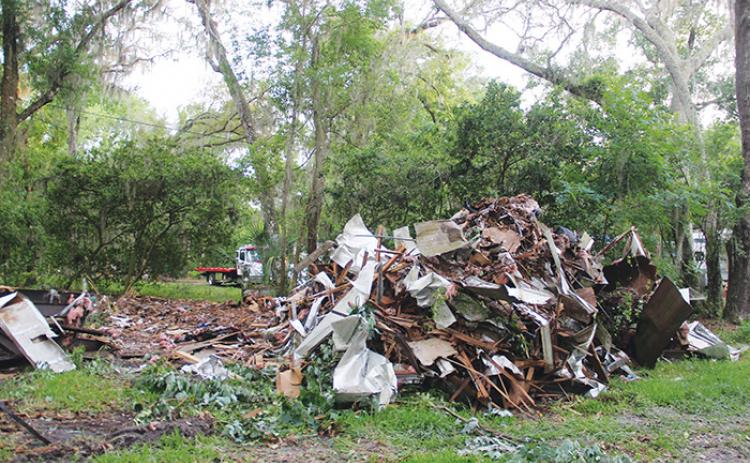 A pile of rubble towers over St. Johns Campground last week, leaving some residents worried their homes could be next. 