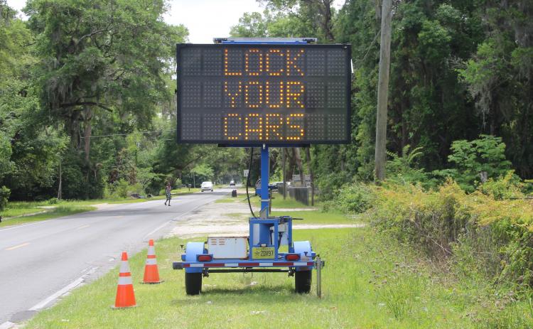 A sign Wednesday afternoon warns residents of a string of car burglaries on Palatka's south side.