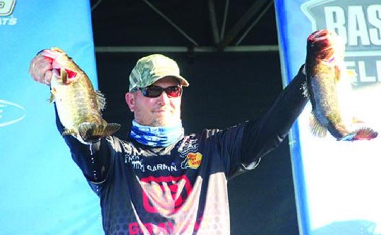 Cliff Prince shows off a couple of his catches during the second day of last year’s AFTCO Bassmaster Elite at the St. Johns River event. Prince finished seventh. (Daily News file photo)