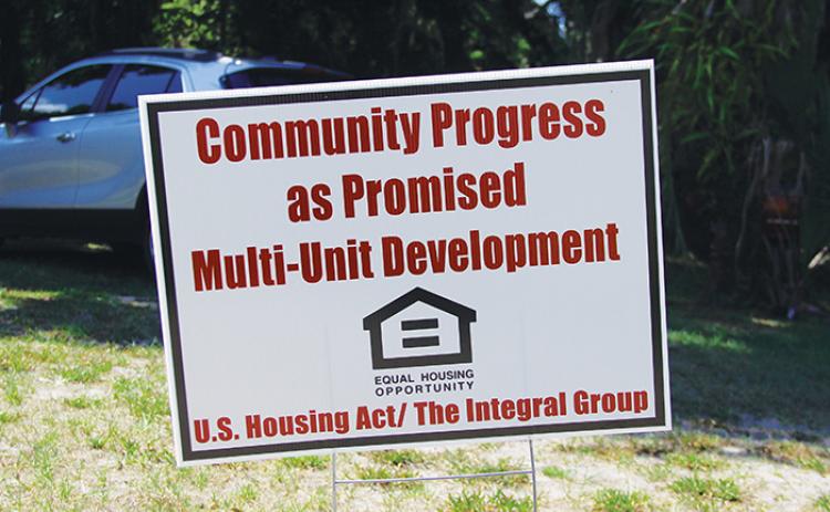 A sign stands in the field beside Hammock Hall Monday morning, alluding to a "multi-unit development." City Manager Don Holmes said Hammock Hall has not been sold and he does not know who put up this sign.