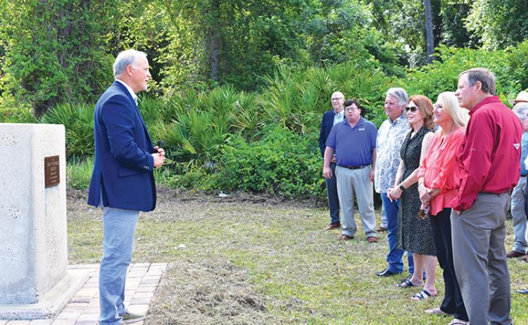 State Rep. Bobby Payne, R-Palatka, speaks to the relatives of John W. Campbell as they and other attendees rededicate County Road 216 in Palatka in Campbell’s honor Friday morning.