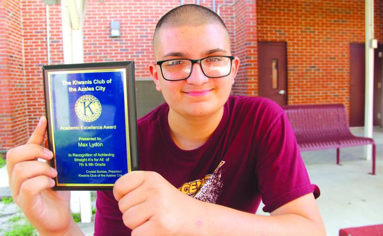 Photos by TRISHA MURPHY / Palatka Daily News Max Lydon, 13, an 8th grader at Crescent City Junior-Senior High School, was recently presented with a plaque and $100 by tThe Kiwanis Club of the Azalea City for making straight A’s all year. 