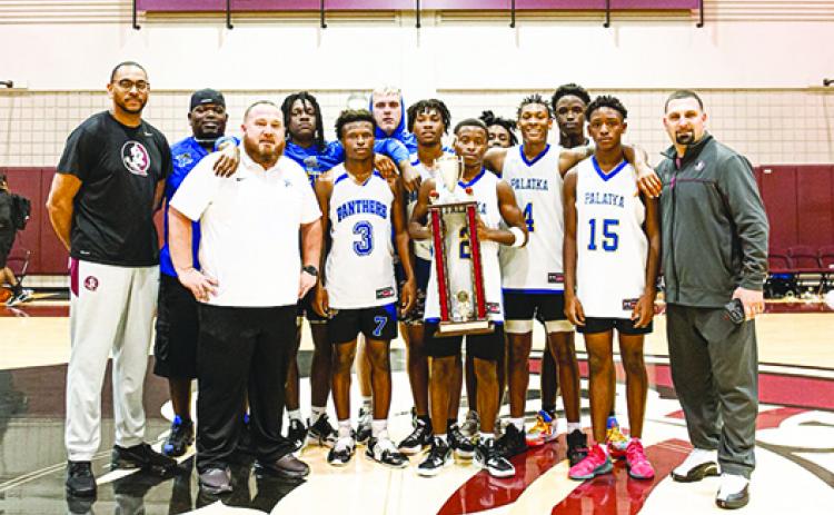 Palatka’s boys basketball team, coached by Bryan Walter (third from left), avenged an early loss to Wilson Academy and won nine straight games to win the Leonard Hamilton Team Camp at Florida State University. (Submitted / Bryan Walter)
