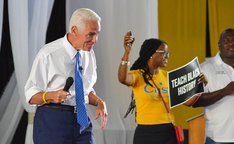 Former governor and current Democratic gubernatorial candidate Charlie Crist pumps up the crowd Saturday during Juneteenth celebrations in Palatka. 