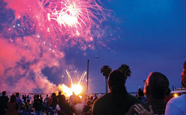 Spectators watch the fireworks display during Red, White & Boom in Crescent City in 2021.
