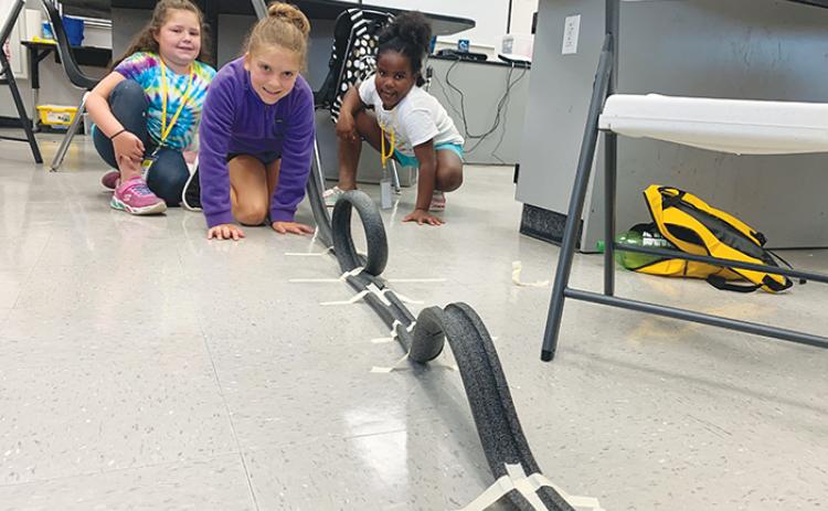 Third graders put their knowledge of physics to use as they design and build roller coasters at the Putnam County School District STEM Summer Camp.