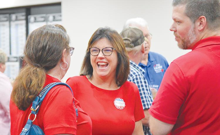 CASMIRA HARRISON/Palatka Daily News Leota Wilkinson, center, talks to Rhonda Williams, left, and David Parsons after the unofficial results from Tuesday’s primary were posted.