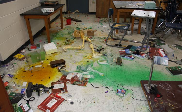 Debris litters a room at Jenkins Middle School following extensive vandalism that authorities say three teenagers carried out Sunday.