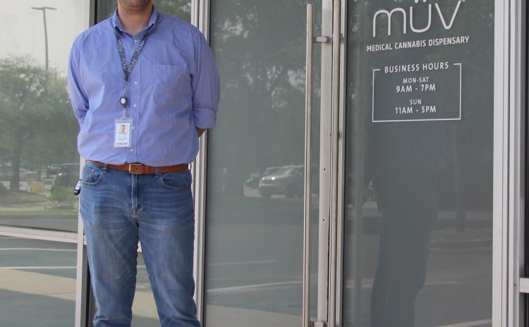 General Manager Ryan Killian stands outside MÜV Medical Cannabis Dispensary on Wednesday, the day after the store opened.