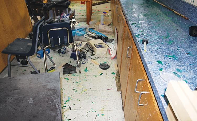 Glass and science equipment are strewn throughout a classroom at the former Jenkins Middle School in Palatka after the property was vandalized by three minors, authorities say.