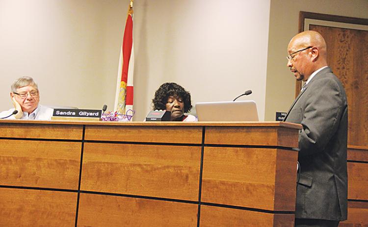 Thomas Bolling, the assistant superintendent for support services, talks to school board members Tuesday about a proposal to sell a school district property in East Palatka.