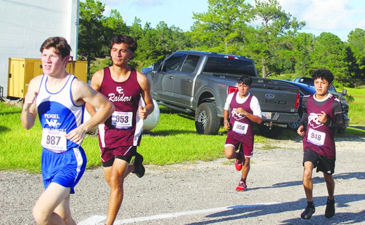 Peniel Baptist Academy standout runner Caleb Baker (left) is chased by Crescent City Junior-Senior High’s trio of (second from left) Jesus Cruz, Norberto Avila and Anthony Vazquez during last week’s Dwayne Cox Invitational at the West Putnam Recreation Center. (MARK BLUMENTHAL / Palatka Daily News)