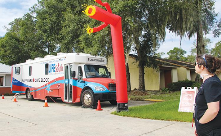 LifeSouth Community Blood Centers employee Amber Boynton watches the Bloodmobile pack up to head to Walmart in Palatka Friday morning. The team will be collecting blood donations over the weekend at 6003 Crill Ave. from 9 a.m. - 2 p.m. Saturday and 10 a.m. - 3 p.m. Sunday.