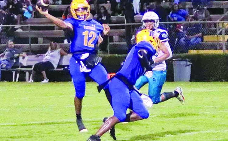 Palatka quarterback Jamarrie McKinnon prepares to throw a pass last Friday at home against Port Orange Atlantic in a 34-7 victory. (RITA FULLERTON / Special to the Daily News)