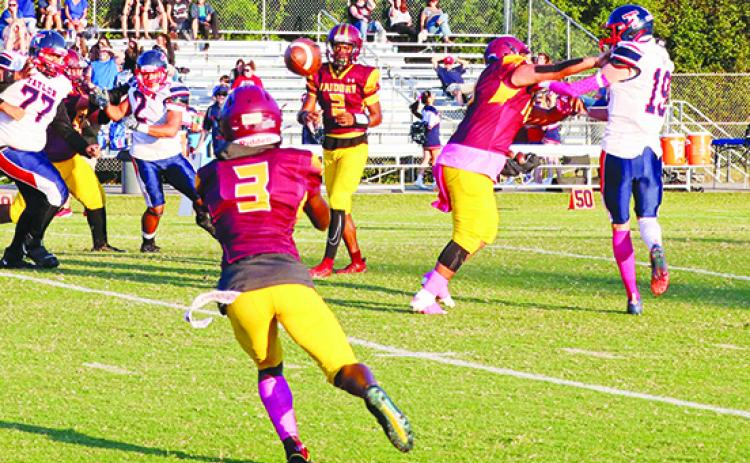 Crescent City’s Eric Jenkins Jr. (2) finds receiver Ray Davis for a 9-yard gain in the first period of Monday’s game against Pierson Taylor. (RITA FULLERTON / Special to the Daily News)