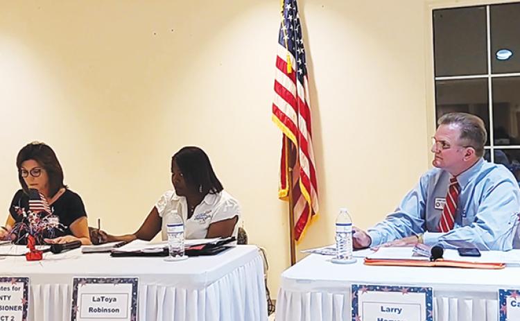 From left, Leota Wilkinson, La’Toya Robinson and Larry Harvey, candidates for the Putnam County Board of Commissioners, participate in a political forum Monday night.