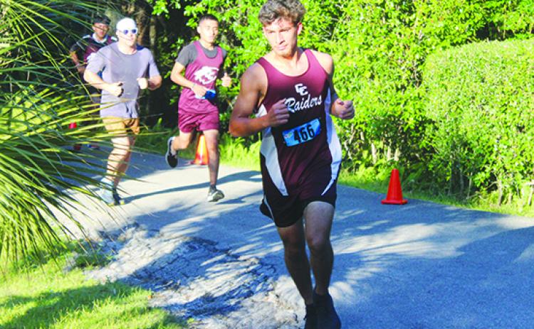 Crescent City’s Jesus Cruz (front) and Norberto Avila (middle) were two of the Raiders’ four runners who finished in the Top 13 in Thursday’s District 3-2A championship meet in Brooksville. The Raiders scored 69 points to finish second in the team competition and advance to the Region 2-2A meet. (MARK BLUMENTHAL / Palatka Daily News)