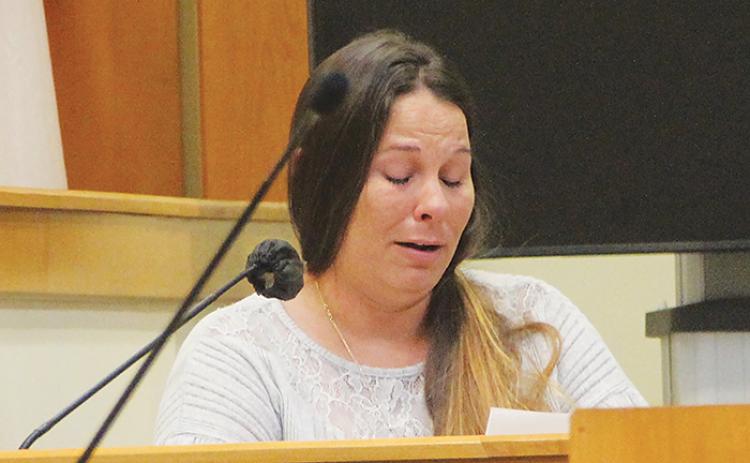 Sarah Baker, the mother of Tayten and Robert Baker, who were murdered in Melrose in 2020, reads her victim impact statement Monday morning during the sentencing phase of Mark Wilson Jr.’s homicide trial.