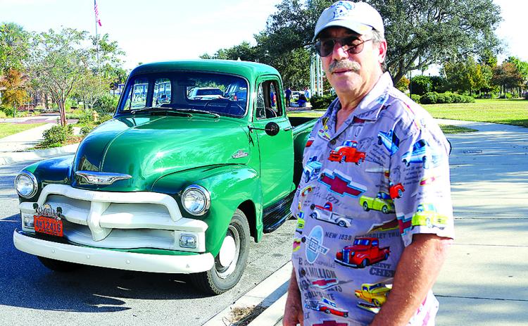 Gary Schneider of Bostwick is pictured with his 1955 Chevrolet pickup truck. The truck still has its original six-cylinder engine and is completely restored to its original look. Schneider, who is a member of the Azalea City Cruisers car club, will have the vehicle on display during this year’s 43rd annual Car and Truck Show Nov. 5 at Palatka Junior-Senior High School’s parking lot on Mellon Road. Spectators are free. The public is invited. (TRISHA MURPHY/Palatka Daily News)