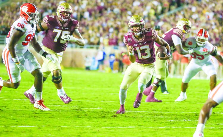 Florida State quarterback Jordan Travis escapes for yards against Clemson at home on Oct. 15. (GREG OYSTER / Special to the Daily News)