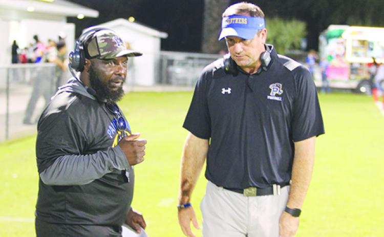 Palatka coach Patrick Turner, right, talking here with assistant Al Smith during a timeout in the Oct. 28 game against Bradford, saw his Panthers make the state tournament as a seventh seed. (MARK BLUMENTHAL / Palatka Daily News)