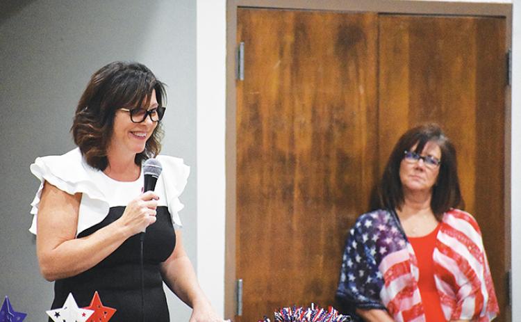 Leota Wilkinson, the winner of the District 2 Board of County Commissioners race, gives her victory speech as her campaign manager, Cristie Lee, looks on.
