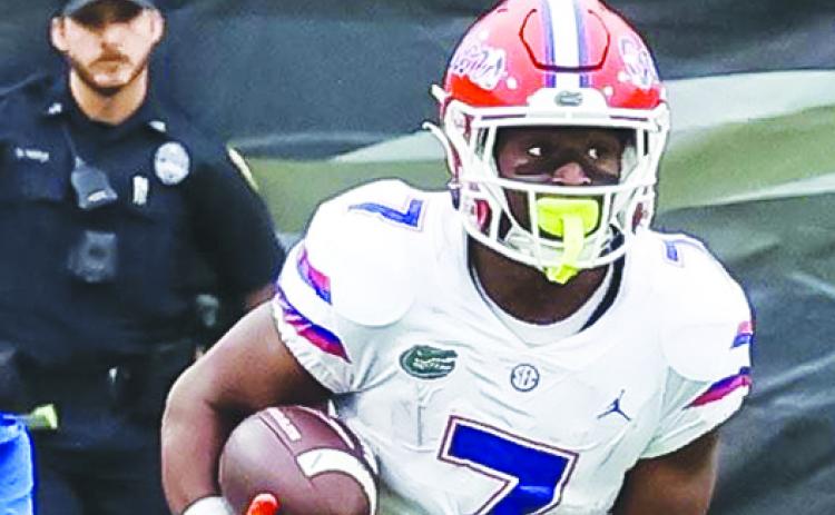 Florida running back Trevor Etienne went for 100 yards rushing and a touchdown Saturday against South Carolina in a 38-6 victory. (JOHN STUDWELL / Special to the Daily News)