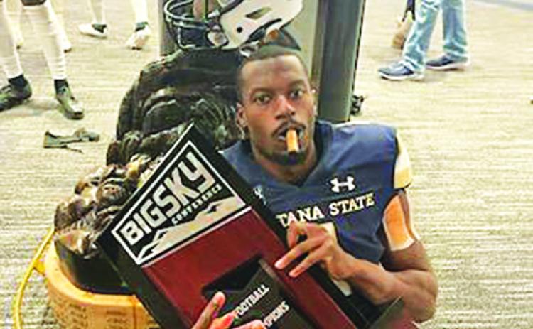 James Campbell III, a 2016 Palatka High graduate, celebrates his Montana State Bobcats' 55-21 win over rival Montana Saturday in Bozeman with a cigar. (JAMES CAMPBELL II / Special to the Daily News)