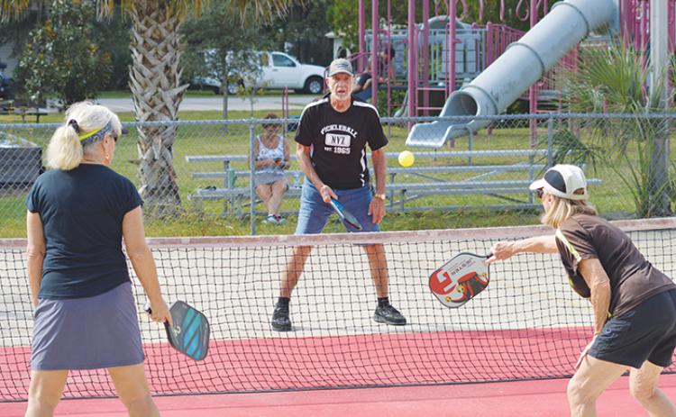 People participate in a pickleball game last month in Welaka.