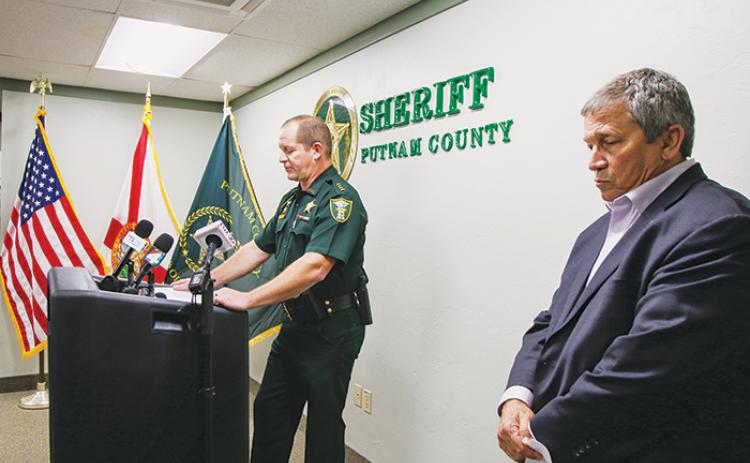 SARAH CAVACINI/Palatka Daily News Putnam County School District Superintendent Rick Surrency (right) waits to speak Monday behind Sheriff Gator DeLoach during a press conference addressing the arrest of a youth resource deputy.