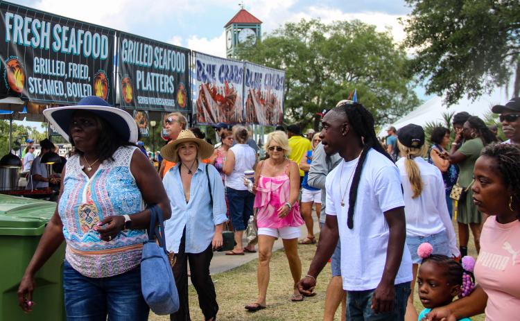 SARAH CAVACINI/Palatka Daily News Guests look for places to eat along the riverfront at the Blue Crab Festival in May. 