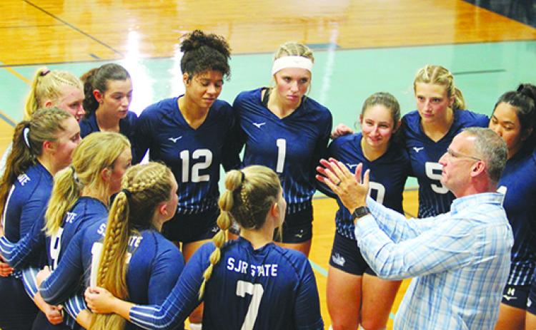 St. Johns River State Colleg volleyball coach Matt Cohen goes over strategy with his team during a timeout in a September match. (MARK BLUMENTHAL / Palatka Daily News)