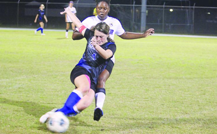 Interlachen’s Madisynn Guessford is taken down from behind by an unidentified Lake Weir player during Tuesday match. (MARK BLUMENTHAL / Palatka Daily News)