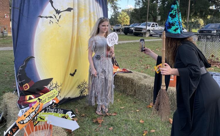 Photo courtesy of the Putnam County Sheriff's Office. A zombie bride gets her photo taken in front of the Palatka Daily News photo booth Monday in Crescent City. 