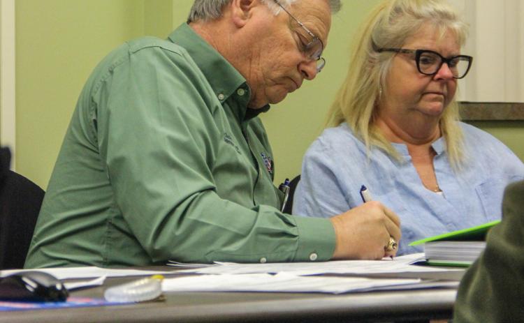 SARAH CAVACINI/Palatka Daily News. Putnam County Supervisor of Elections Charles Overturf III signs off Friday on election results to make them official. 